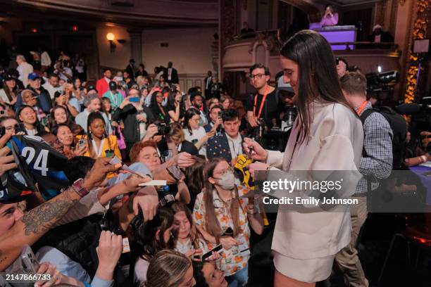 Caitlin Clark signs autographs during the 2024 WNBA Draft on April 15, 2024 at the Brooklyn Academy of Music in Brooklyn, New York. NOTE TO USER:...