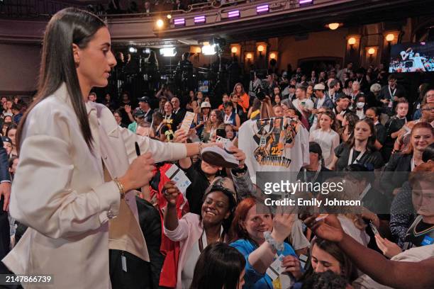 Caitlin Clark signs autographs during the 2024 WNBA Draft on April 15, 2024 at the Brooklyn Academy of Music in Brooklyn, New York. NOTE TO USER:...