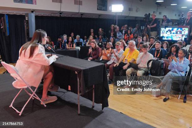 Caitlin Clark talks to the media after being drafted first overall by the Indiana Fever during the 2024 WNBA Draft on April 15, 2024 at the Brooklyn...