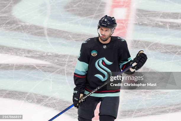 Justin Schultz of the Seattle Kraken looks on during the second period of a game against the San Jose Sharks at Climate Pledge Arena on April 11,...