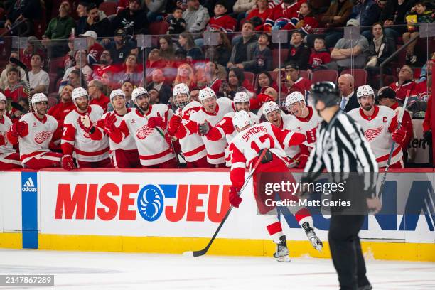 Daniel Sprong of the Detroit Red Wings celebrates a goal with the bench during the third period the NHL regular season game between the Montreal...