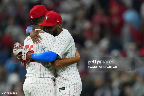 Ranger Suarez of the Philadelphia Phillies hugs Johan Rojas after pitching a complete game shutout against the Colorado Rockies at Citizens Bank Park...