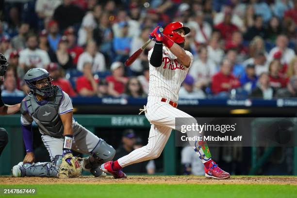 Bryce Harper of the Philadelphia Phillies hits a two run home run in the bottom of the eighth inning against the Colorado Rockies at Citizens Bank...