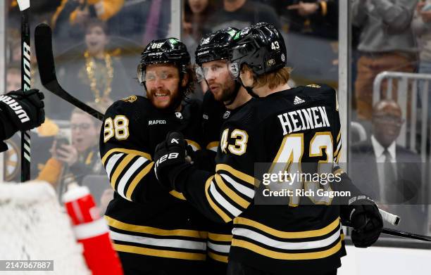 Pavel Zacha of the Boston Bruins celebrates his goal with Danton Heinen and David Pastrnak against the Ottawa Senators in the third period at the TD...