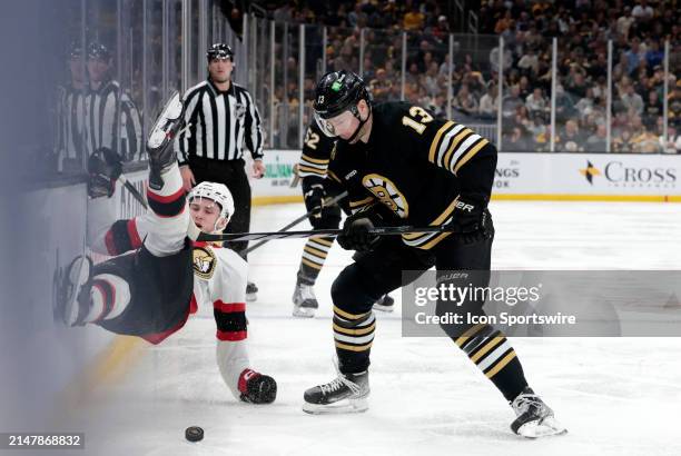 Boston Bruins center Charlie Coyle picks up the puck during a game between the Boston Bruins and the Ottawa Senators on April 16 at TD Garden in...