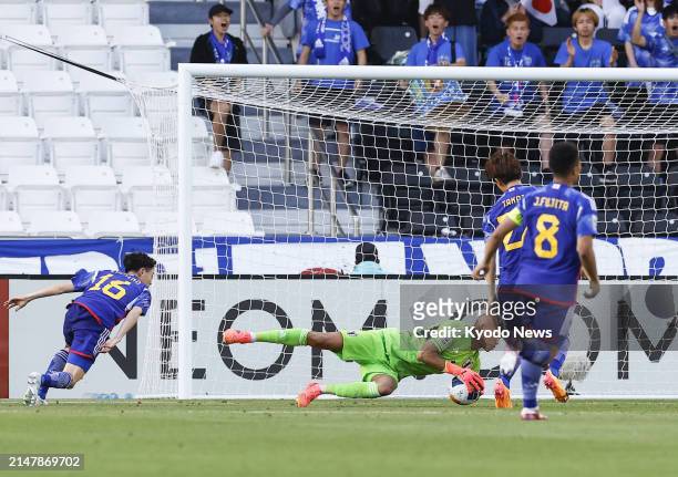 Leo Brian Kokubo of Japan makes a save during the second half of an under-23 Asian Cup men's football group-stage match against China in Doha on...
