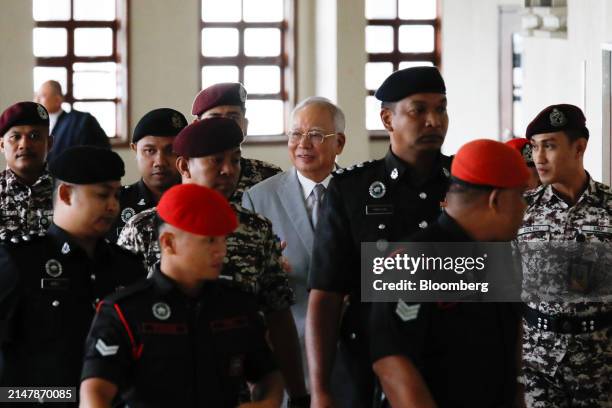 Najib Razak, Malaysia's former prime minister, center, at the Kuala Lumpur Courts Complex in Kuala Lumpur, Malaysia, on Wednesday, April 17, 2024....