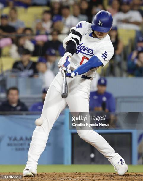 Shohei Ohtani of the Los Angeles Dodgers grounds out in the fourth inning of a baseball game against the Washington Nationals at Dodger Stadium in...