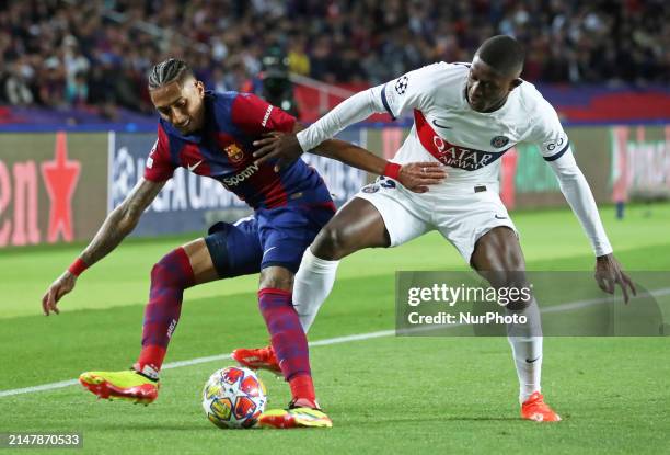 Raphinha Dias and Nuno Mendes are playing in the match between FC Barcelona and PSG for the Quarter-Final of the UEFA Champions League at the Olympic...