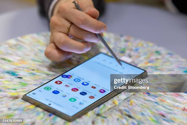 An attendee tries out a Samsung Electronics Co. Galaxy S24 Ultra smartphone at the World IT Show in Seoul, South Korea, on Wednesday, April 17, 2024....