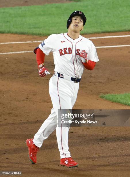 Boston Red Sox designated hitter Masataka Yoshida reacts after flying out in the fifth inning of a baseball game against the Cleveland Guardians at...