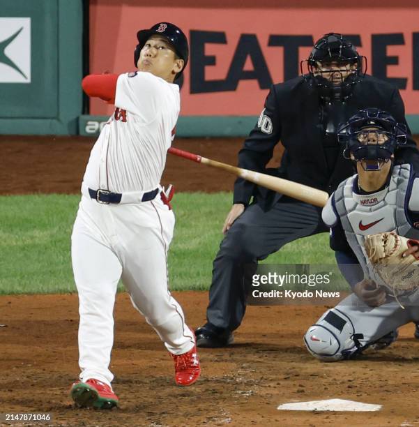 Boston Red Sox designated hitter Masataka Yoshida flies out in the fifth inning of a baseball game against the Cleveland Guardians at Fenway Park in...