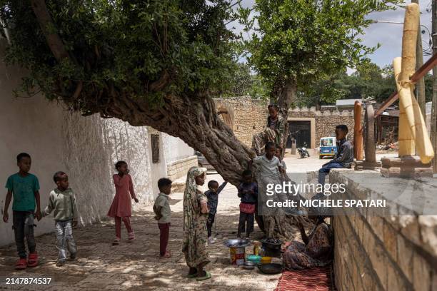 Children climb a tree inside Harar walled city on April 17, 2024. Founded in the 10th century, Harar - also called Jugol - is reputed to be one of...