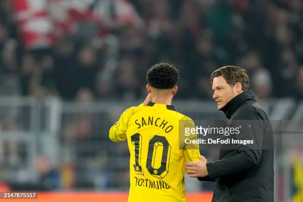 Jadon Sancho of Borussia Dortmund and head coach Edin Terzic of Borussia Dortmund discuss during the UEFA Champions League quarter-final second leg...