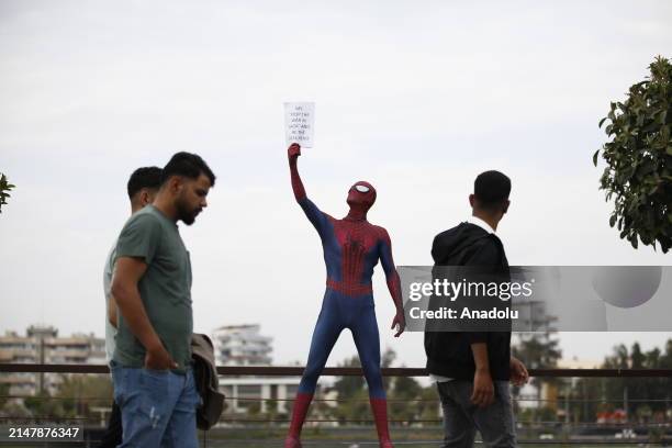 Burak Soylu, known for his 'Spider-Man' costume in the streets and parks of Antalya, takes a city tour to draw attention to the children who lost...