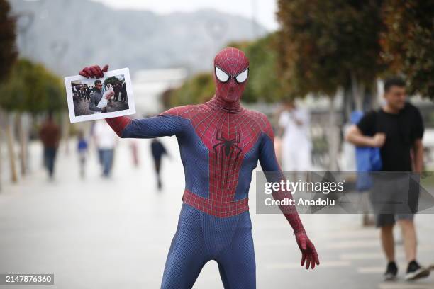 Burak Soylu, known for his 'Spider-Man' costume in the streets and parks of Antalya, takes a city tour to draw attention to the children who lost...