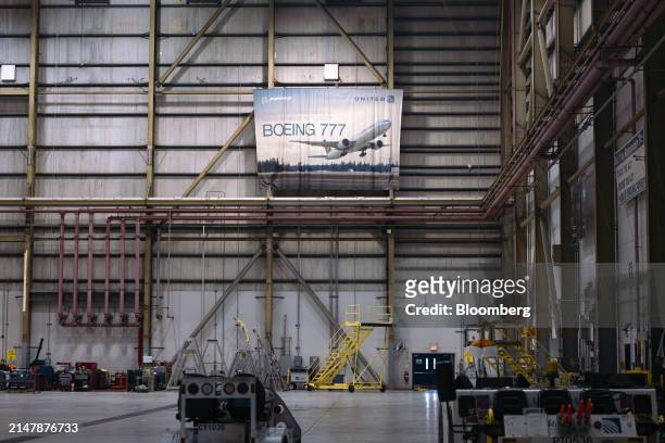Banner advertising the Boeing 777 airplane in a United Airlines maintenance hangar at Newark Liberty International Airport in Newark, New Jersey, US,...
