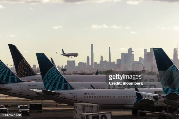 United Airlines plane lands at Newark Liberty International Airport in Newark, New Jersey, US, on Tuesday, March 19, 2024. United Airlines Holdings...