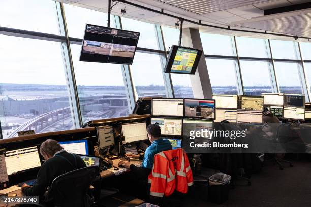 Workers in the United Airlines Station Operation Center at Newark Liberty International Airport in Newark, New Jersey, US, on Tuesday, March 19,...