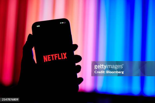 The Netflix logo on a smartphone arranged in the Queens borough of New York, US, on Tuesday, March 26, 2024. Netflix Inc. Is scheduled to release...