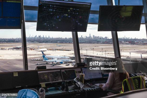 Worker in the United Airlines Station Operation Center at Newark Liberty International Airport in Newark, New Jersey, US, on Tuesday, March 19, 2024....