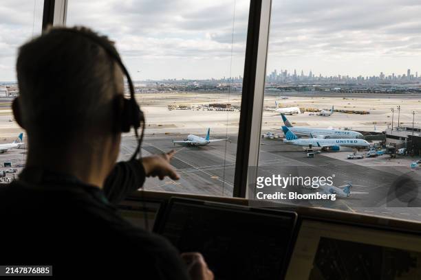 Worker in the United Airlines Station Operation Center at Newark Liberty International Airport in Newark, New Jersey, US, on Tuesday, March 19, 2024....