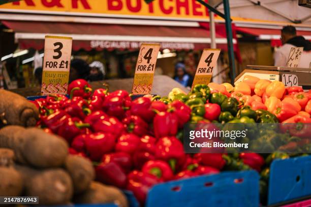 Price labels on boxes of peppers on a grocery stall at East Street Market in London, UK, on Wednesday, April 17, 2024. UK inflation slowed less than...