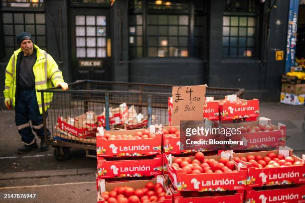 Boxes of tomatoes on a grocery stall at East Street Market in London, UK, on Wednesday, April 17, 2024. UK inflation slowed less than expected last...