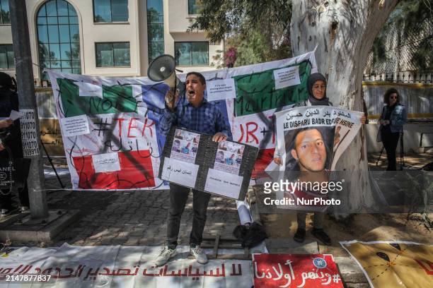 Protester is giving a speech through a megaphone during a demonstration on the occasion of Italian Prime Minister Giorgia Meloni's visit in Tunis,...