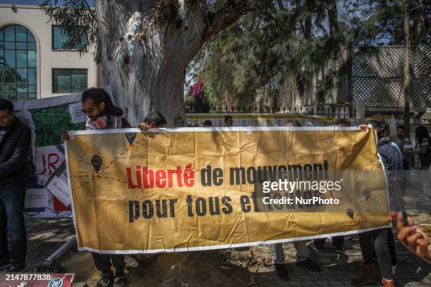 Demonstrators are holding a banner that reads in French, ''Freedom of movement for all,'' during a demonstration on the occasion of Italian Prime...