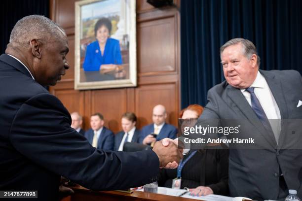 Secretary of Defense Lloyd Austin greets Chairman Ken Calvert as he arrives for a House Appropriations Committee hearing on Capitol Hill on April 17,...