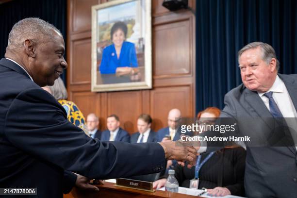 Secretary of Defense Lloyd Austin greets Chairman Ken Calvert as he arrives for a House Appropriations Committee hearing on Capitol Hill on April 17,...