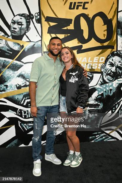 Maycee Barber and Youssef Zalal pose in front of the UFC 300 mural backstage during UFC 300 at T-Mobile Arena on April 13, 2024 in Las Vegas, Nevada.