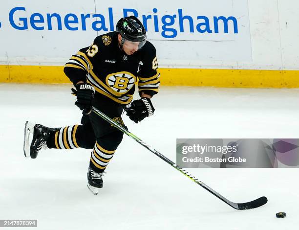 Boston, MA Boston Bruins left wing Brad Marchand skates with the puck in the first period.