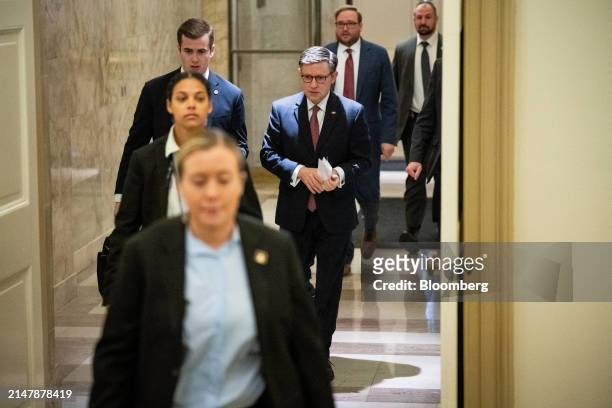House Speaker Mike Johnson, a Republican from Louisiana, center, arrives at the US Capitol in Washington, DC, US, on Wednesday, April 17, 2024....
