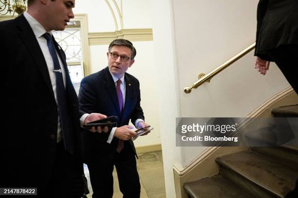 House Speaker Mike Johnson, a Republican from Louisiana, second left, arrives at the US Capitol in Washington, DC, US, on Wednesday, April 17, 2024....