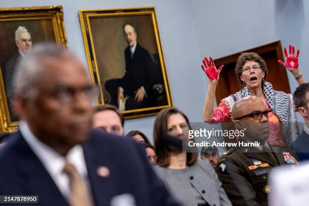 Protester from the group Code Pink disrupts U.S. Secretary of Defense Lloyd Austin as he speaks at a House Appropriations Committee hearing on...