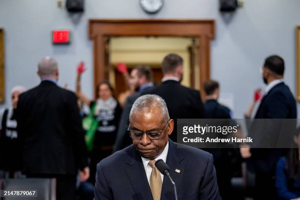 Secretary of Defense Lloyd Austin is interrupted by protesters from the group Code Pink as he speaks at a House Appropriations Committee hearing on...