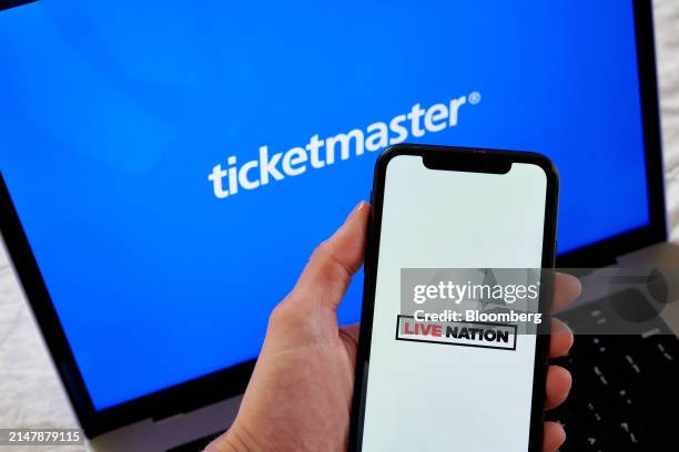 Live Nation and Ticketmaster logos arranged on a smartphone and laptop in New York, US, on Wednesday, April 17, 2024. The Justice Department may file...