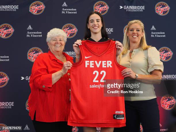 Caitlin Clark of the Indiana Fever poses for a photo with Lin Dunn and Christie Sides during her introductory press conference on April 17, 2024 at...