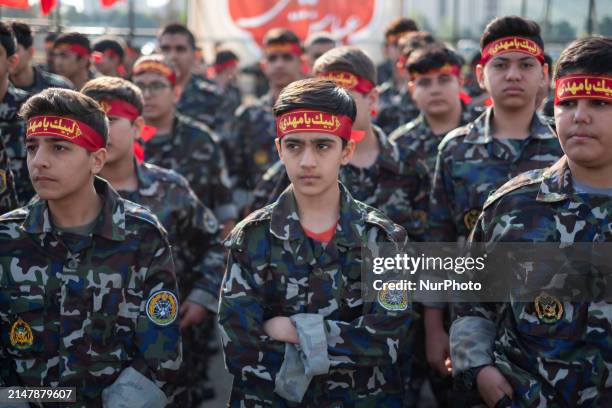 Iranian schoolboys, who are also members of the Basij paramilitary force, are preparing to march in a military parade marking Iran's Army Day...