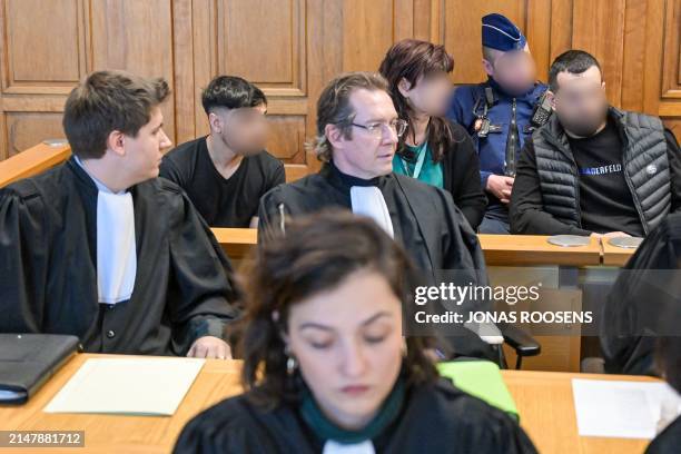 Two of the accused are pictured at the jury constitution at the start of the trial against eight accused concerning the death of Romanian...