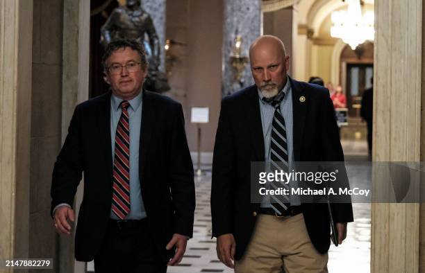 Rep. Thomas Massie and U.S. Rep. Chip Roy walk to Speaker of the House Mike Johnson's office at the U.S Capitol on April 17, 2024 in Washington, DC....