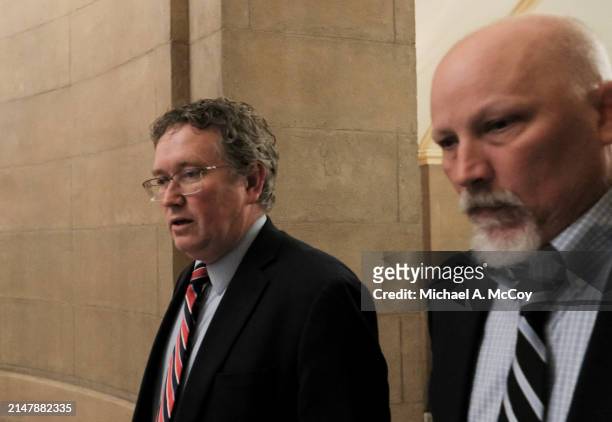 Rep. Thomas Massie and U.S. Rep. Chip Roy walk to Speaker of the House Mike Johnson's office at the U.S Capitol on April 17, 2024 in Washington, DC....