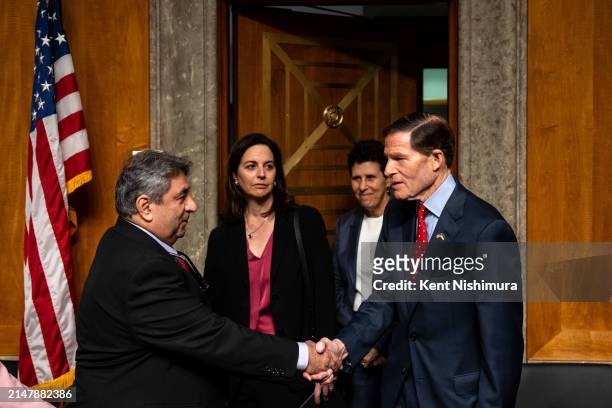 Boeing engineer Sam Salehpour greets chairman Sen. Richard Blumenthal before the start of a Senate Homeland Security and Governmental Affairs...