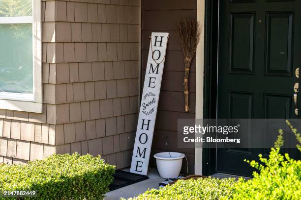Home sweet home" sign in front of a home in the Issaquah Highlands area of Issaquah, Washington, US, on Tuesday, April 16, 2024. The National...