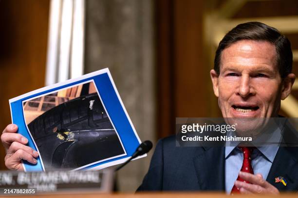Chairman Sen. Richard Blumenthal holds up a photograph of the tire of whistleblower Sam Salehpour that was punctured by a nail, during a Senate...