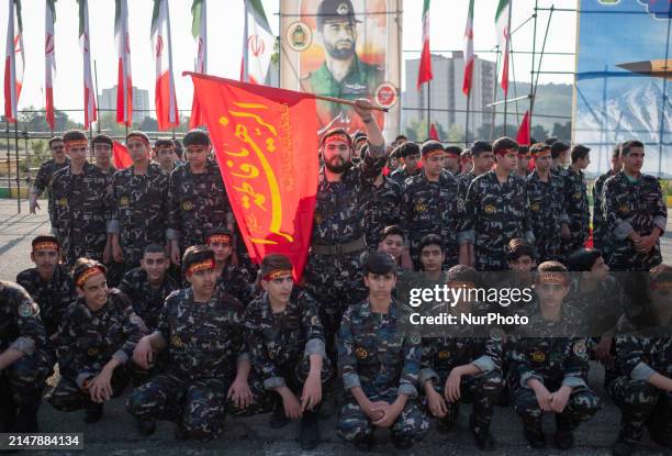 Members of the Basij paramilitary force are posing for a photograph as they prepare to march in a military parade marking Iran's Army Day anniversary...