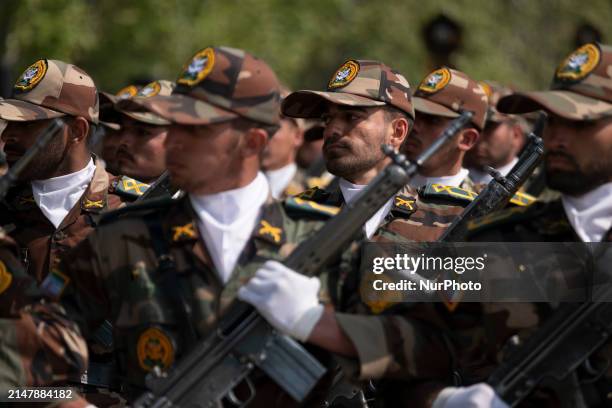 Members of the Iranian Army's land force are marching in a military parade to mark the anniversary of Iran's Army Day at an Army military base in...