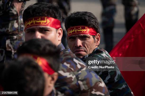 Members of the Basij paramilitary force are preparing to march in a military parade marking Iran's Army Day anniversary at an Army military base in...